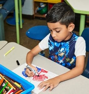 Young boy coloring