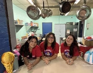 3 girls behind counter